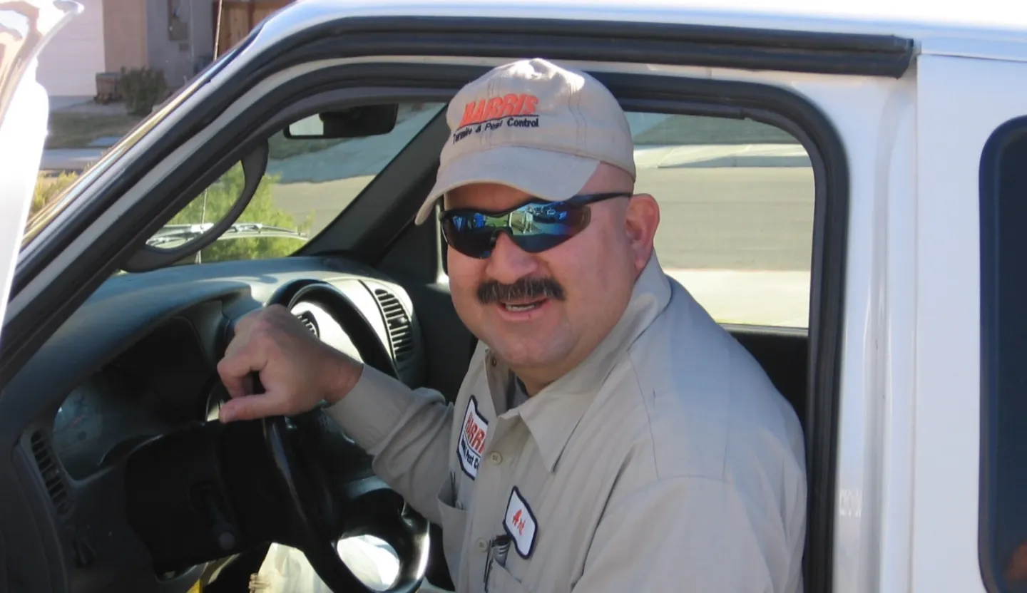 A man sitting in the drivers seat of his car.